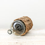 18.25 Inch Clear Glass Bottle in Rattan Woven Basket